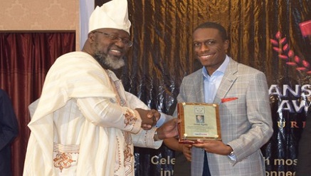 Barr. Adebayo Shittu, Minister of Communication Technology, presenting Outstanding Commitment to the Development of the Nigerian ICT Industry award to Kunle Ayodeji, Chief Operating Officer, Computer Warehouse Group, at the Titans of Tech Award 2016 held recently in Lagos.